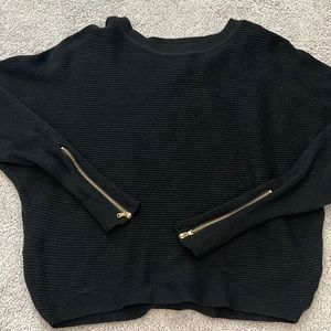 Women’s black sweater. Zipper on the sleeves new never worn.